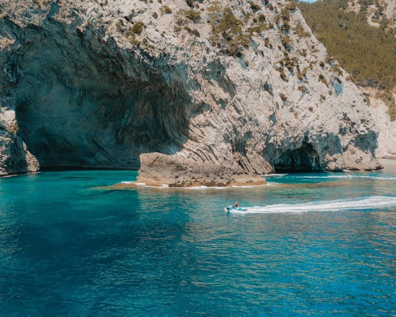 Alcudia: JetSki Tour Coll Baix beach & Caves (free Photos) - Alcanada lighthouse island: the easy photo stop that makes it feel special