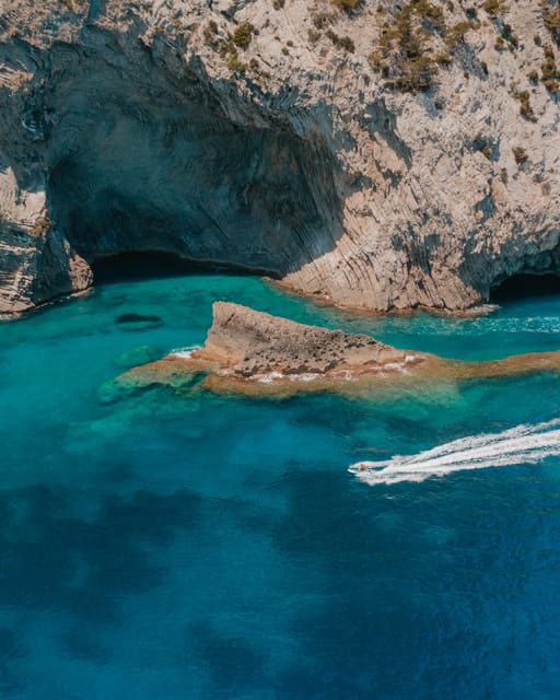Alcudia: JetSki Tour Coll Baix beach & Caves (free Photos) - Coll Baix caves and cove: crystal water plus a real swim break