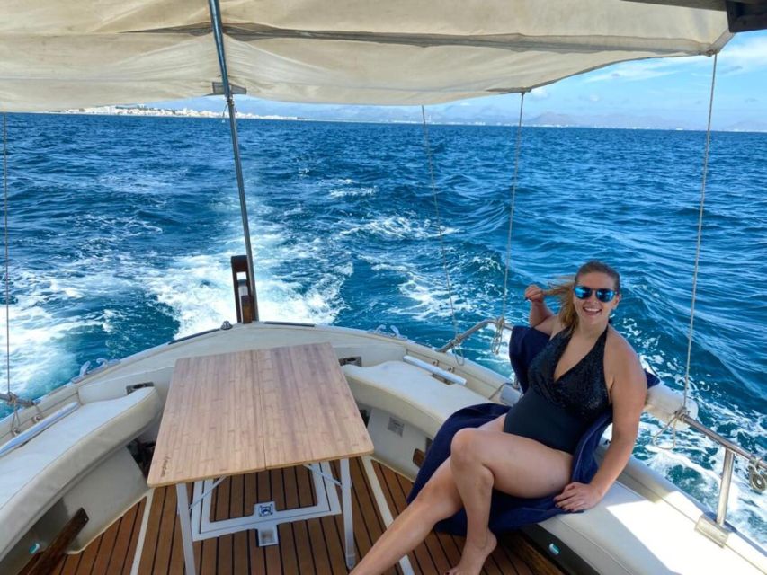 Alcudia: Traditional Wooden Boat Trip with Snorkeling - Aucanada lighthouse stop: scenery plus a scenic return dip