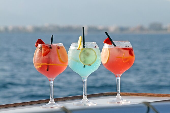 Catamaran sailing at sunset with tapas Palma de Mallorca - The Cala Vella cove stop: swimming time, paddle surf, and a pacing reality check