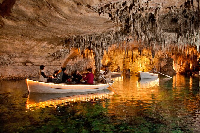Full day tour to the Caves of Drach and Caves of Hams in Mallorca - Entering Cuevas del Drach: Sunrise Light, Boat Musicians, and Lake Martel