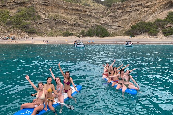 Mallorca Beach & Caves 4hr Boat Trip Drinks, Tapas, SUP & Snorkel - Alcanada Island and the lighthouse: snacks, sun, and second swim time
