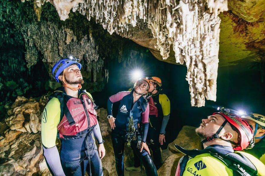 Mallorca: Cova des Coloms Caving Trip with Hotel Transfer - Inside the cave: limestone formations, vertical sections, and natural pools
