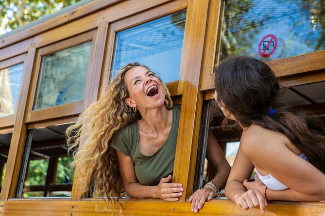 Mallorca in One Day Sightseeing Tour with Boat Ride and Vintage Train - Tram to Sóller and the Wooden Train: Oranges, Tunnels, and the Son Reus Stop