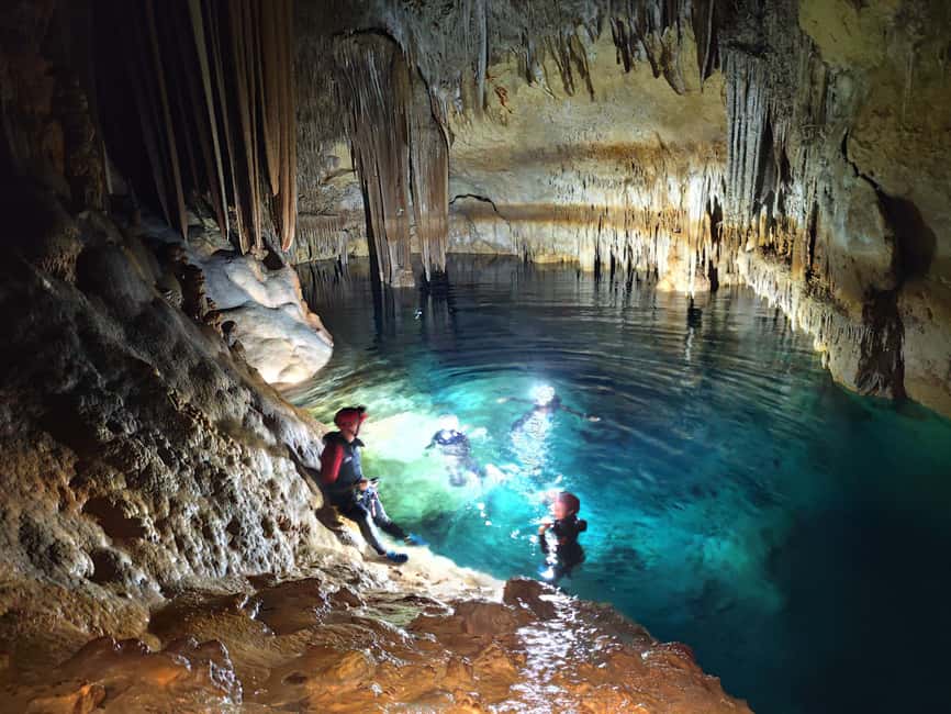 Mallorca: Sea Cave Adventure at Cova de Coloms - Inside the cave: red minerals, tunnels, and crystal pools