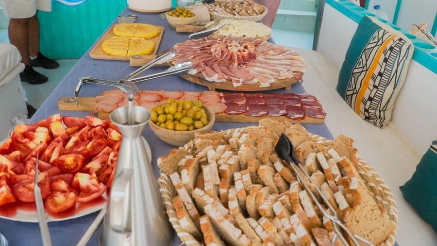 Palma: Punta Negra and Ses Illetes Boat Trip with Live Music - Living On Deck: Solarium Sun, Lounge Sofas, and Sax-and-Violin Vibes