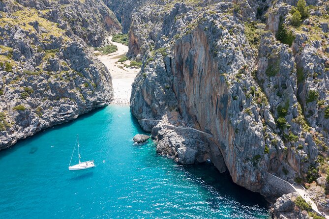 Scenic tour by Train, Tram and Boat through the lakes - Serra de Tramuntana: reservoirs, forests, and high-peak views
